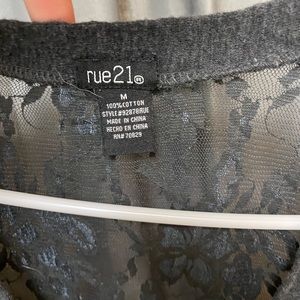 Women’s half sleeve, short sleeve sweater, size medium.